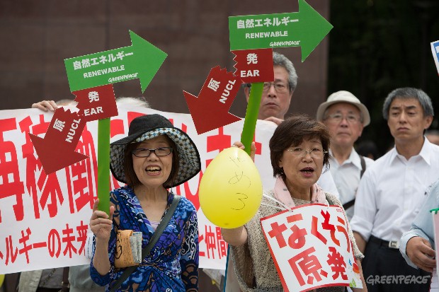 Calling for a shift away from nuclear energy investments, Greenpeace activists protest outside the annual general meetings of the Kansai Electric Power Company (KEPCO)  in Osaka, Japan, on Wednesday 27th June 2012.